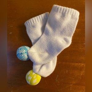 Gently used Lovevery rattle socks